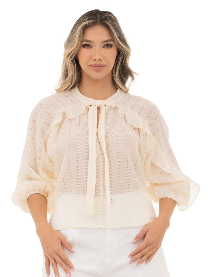 Blusas elegantes con silueta holgada y acabado sofisticado