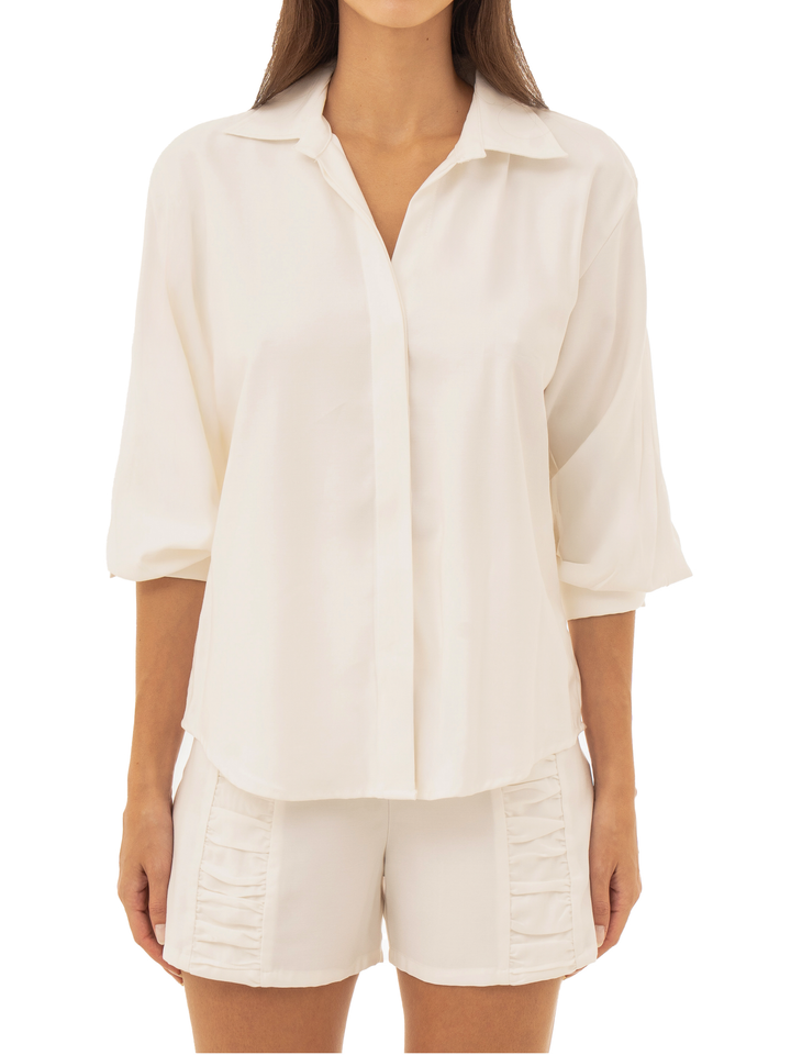 blusas para eventos con ruedo curvo y puños con botones